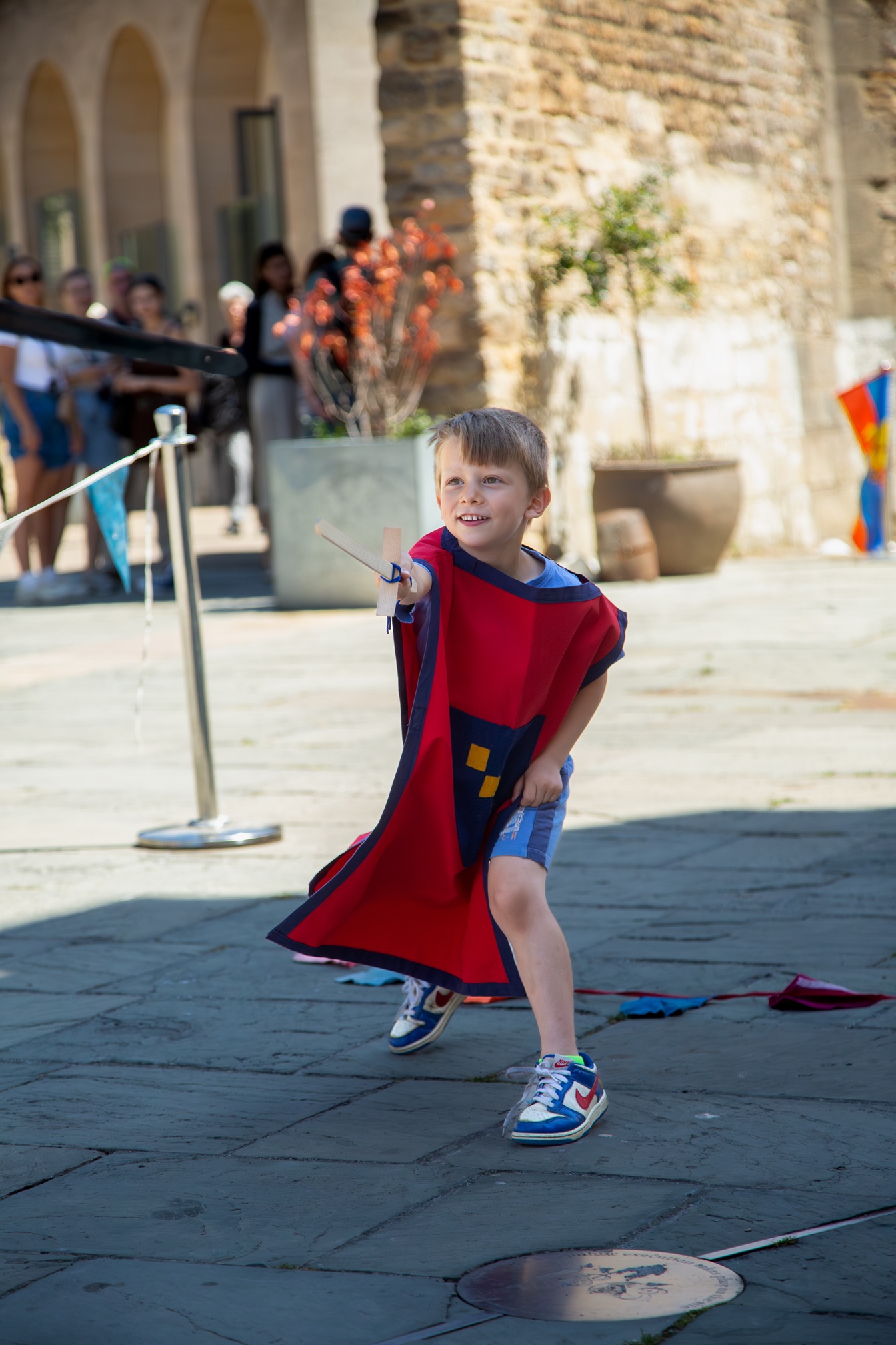 Child practicing their wooden sword skills 