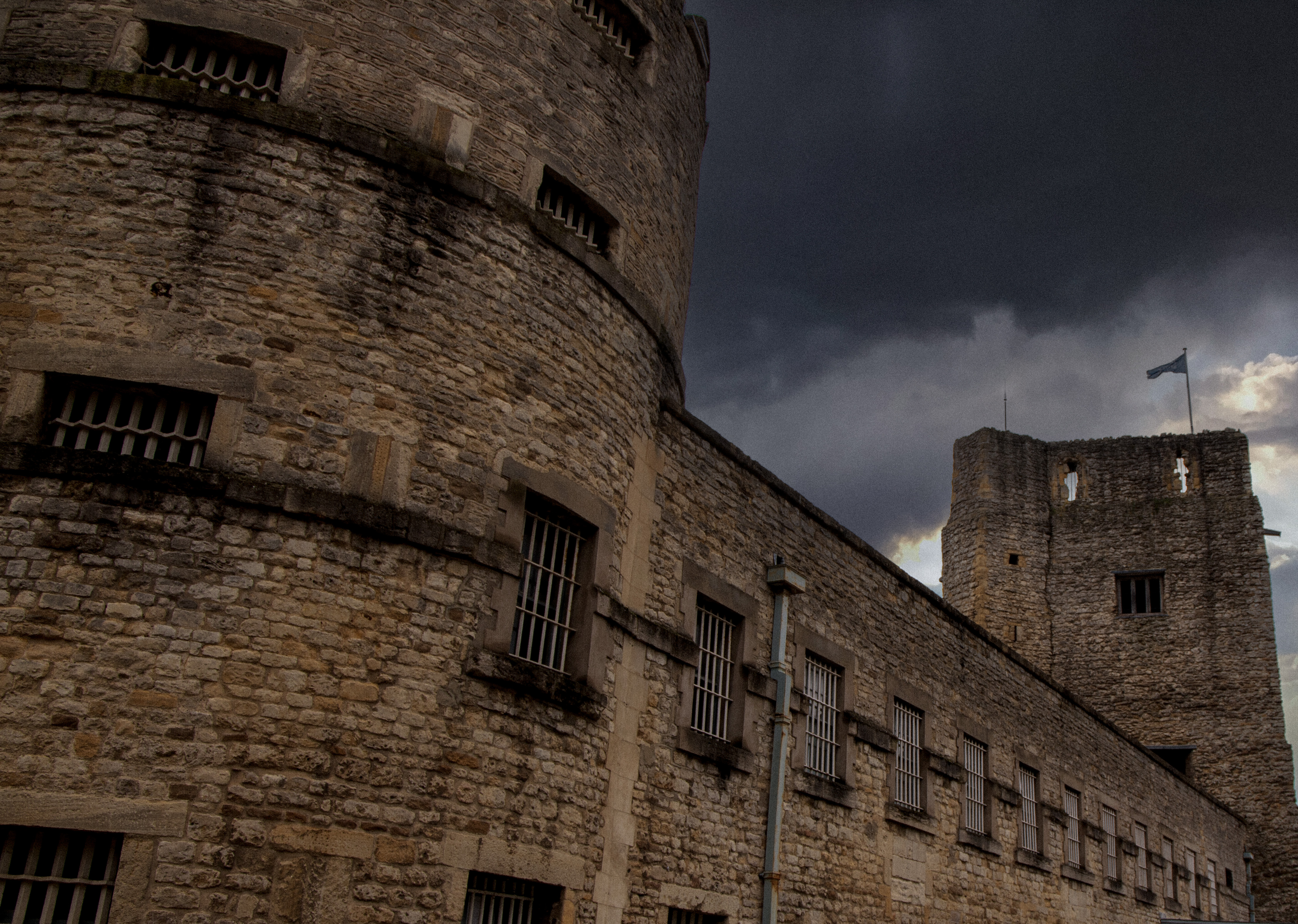 The Oxford Castle Prison under the dark grey skies during Autumn