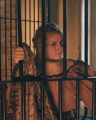 Elizabeth Boswell smiling behind bars
