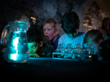 Kids enthralled watching magic demonstrations by Merlin's apprentice as part of the Potion Making Experience at Oxford Castle Prison