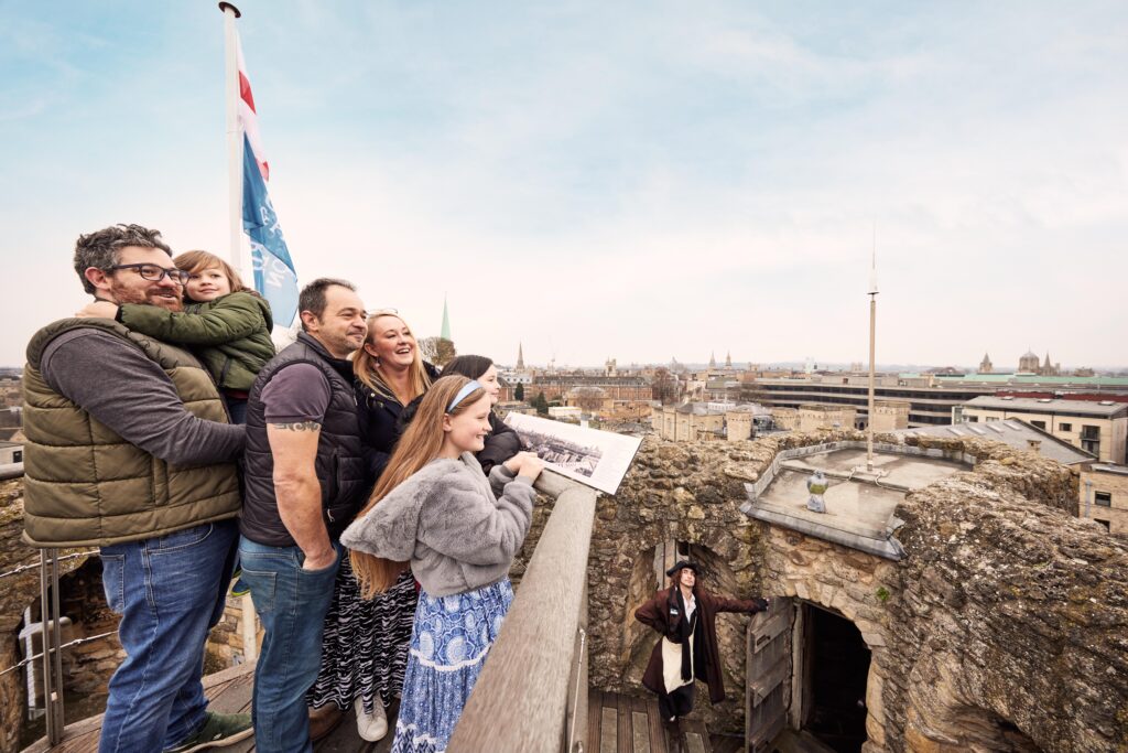 An image of a family looking out over Oxford from Oxford Castle & Prison