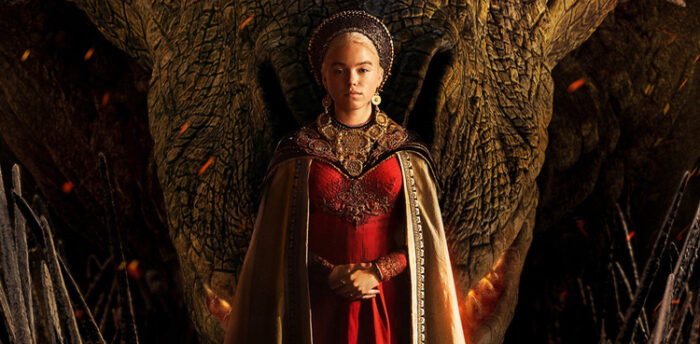 A princess stands in front of a dragon in red dress 